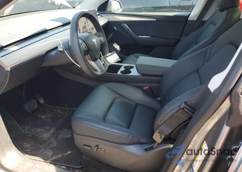 2024 Tesla Model Y from USA, damaged, VIN 7SAYGDEE1RA328570